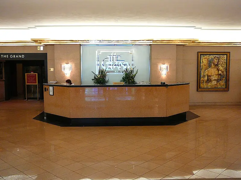 Hotel-style concierge desk in a bright lobby